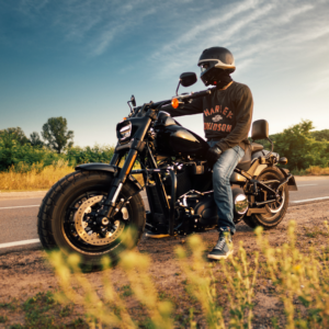 Image of a person riding a Harley Davidson motorcycle